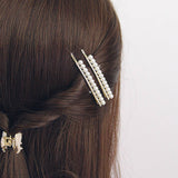 A PAIR OF ELEGANT PEARL AND RHINESTONE HAIR PIN_CWAHA1232