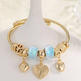 GOLD STEEL BRACELET WITH BEAR HEART CHARMS_CWMM8485