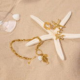 FISHBONE SHELL CHARM BRACELET 18K GOLD STEEL_CWAJE4752