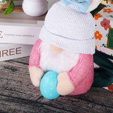 EASTER EARS BUNNY HOLDING EGG DWARF DOLL_CWMM3477