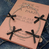 HAND WOVEN BLACK CRYSTAL BEADED BOW NECKLACE_CWAJE3075