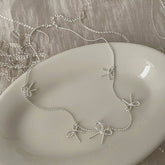 Womens Temperament Metal Bow Tassel Necklace