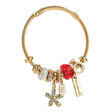 GOLD STAINLESS STEEL BRACELET WITH FLOWER PENDANT_CWMM8587