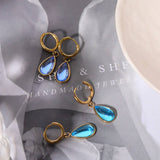 TEARDROP BIRTHSTONE EARRINGS GOLD STAINLESS_CWAJE5032