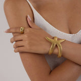 18K GOLD HAMMERED STARFISH OPEN BANGLE NO FADE_CWAJE4684