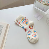 MILKY WHITE DOODLE SMILEY PATTERN CREW SOCKS_CWMS0208