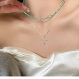 DOUBLE LAYERED CROSS PENDANT NECKLACE_CWAJE2062