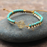 GOLD TONE REIKI SYMBOL YOGA BRAIDED BRACELET_CWAJE3922