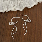 FASHIONABLE HIGH GRADE METAL BOW PENDANT EARRINGS_CWAJE2997