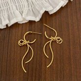 FASHIONABLE HIGH GRADE METAL BOW PENDANT EARRINGS_CWAJE2997