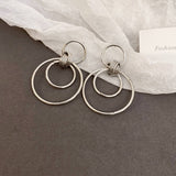 MINIMALIST GLOSSY CIRCULAR COMMUTING EARRINGS_CWAJE2049