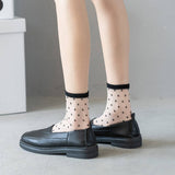 BLACK AND WHITE JACQUARD TRANSPARENT MID TUBE SOCKS_CWMS0414