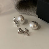 TEMPERAMENTAL AND HIGH END BOW PEARL EARRINGS_CWAJE2971