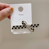 BLACK AND WHITE CHECKERBOARD PEARL BOW HAIRPIN_CWAHA4776