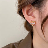 NEW EXQUISITE FASHION HOLLOW HEART PEARL EARRINGS_CWAJE3161