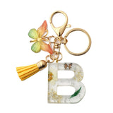 FLOWER LETTER KEYCHAIN WITH YELLOW BUTTERFLY CHARM_CWAB5090