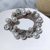 BEADED HAIR TIE WITH METAL PENDANT PEARL BAND_CWAHA6876