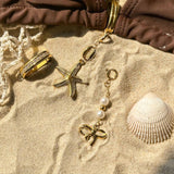 STAINLESS STEEL BIKINI BUCKLE BOW PEARL PENDANT_CWMM4690