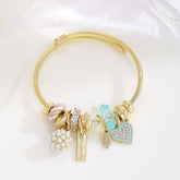 GOLD BRACELET WITH TREE HEART TAIL CHARMS_CWMM8620