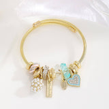 GOLD BRACELET WITH TREE HEART TAIL CHARMS_CWMM8620