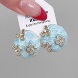 HOLLOW ZIRCON GEOMETRIC FLOWER EARRINGS_CWAJE2040