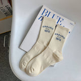 STRIPED COLOR BLOCK LETTERING SPORTS SOCKS_CWMS0964