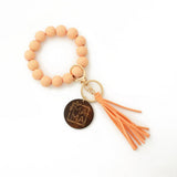 LEOPARD WOOD BEAD BRACELET WITH TASSEL KEYCHAIN_CWAB5107