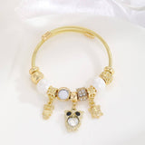 GOLD BRACELET WITH TREE HEART TAIL CHARMS_CWMM8620