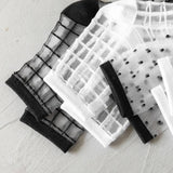 BLACK AND WHITE JACQUARD TRANSPARENT MID TUBE SOCKS_CWMS0414