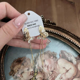 HOLLOW BUTTERFLY TASSEL EARRINGS_CWAJE1287