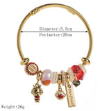 GOLD STAINLESS STEEL BRACELET WITH ANIMAL CHARMS_CWMM8574