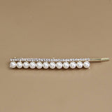 A PAIR OF ELEGANT PEARL AND RHINESTONE HAIR PIN_CWAHA1232