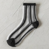 BLACK AND WHITE JACQUARD TRANSPARENT MID TUBE SOCKS_CWMS0414