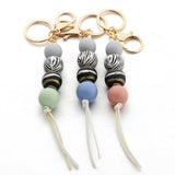 LEOPARD WOOD BEAD KEYCHAIN WITH MINI TASSEL_CWMM7022