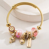 GOLD STAINLESS STEEL BRACELET WITH ANIMAL CHARMS_CWMM8574