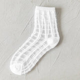 BLACK AND WHITE JACQUARD TRANSPARENT MID TUBE SOCKS_CWMS0414