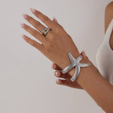 18K GOLD HAMMERED STARFISH OPEN BANGLE NO FADE_CWAJE4684