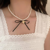 BOWKNOT DOUBLE PEARL HEART PENDANT NECKLACE_CWAJE3080