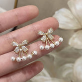 SWEET PEARL INLAID BOW ONE PAIR TWO WEAR EARRINGS_CWAJE3013