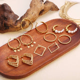 CIRCLE STAINLESS STEEL TWISTED DIAMOND EARRINGS_CWMM3612