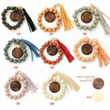 LEOPARD WOOD BEAD BRACELET WITH TASSEL KEYCHAIN_CWAB5107
