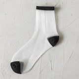 BLACK AND WHITE JACQUARD TRANSPARENT MID TUBE SOCKS_CWMS0414