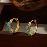 STAINLESS STEEL FLOWER EARRINGS WITH DIAMONDS_CWMM3598