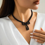 IMITATION PEARL BEADED NECKLACE WITH PEARL BOW_CWAJE1163