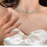 DOUBLE LAYERED CROSS PENDANT NECKLACE_CWAJE2062