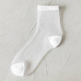 BLACK AND WHITE JACQUARD TRANSPARENT MID TUBE SOCKS_CWMS0414