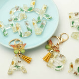 FLOWER LETTER KEYCHAIN WITH YELLOW BUTTERFLY CHARM_CWAB5090