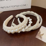 RETRO LOVE TWIST PEARL HEADBAND_CWAHA0829