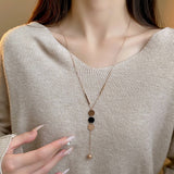 GEOMETRIC SEQUIN TASSEL NECKLACE_CWAJE2370
