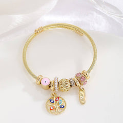 GOLD BRACELET WITH TREE HEART TAIL CHARMS_CWMM8620